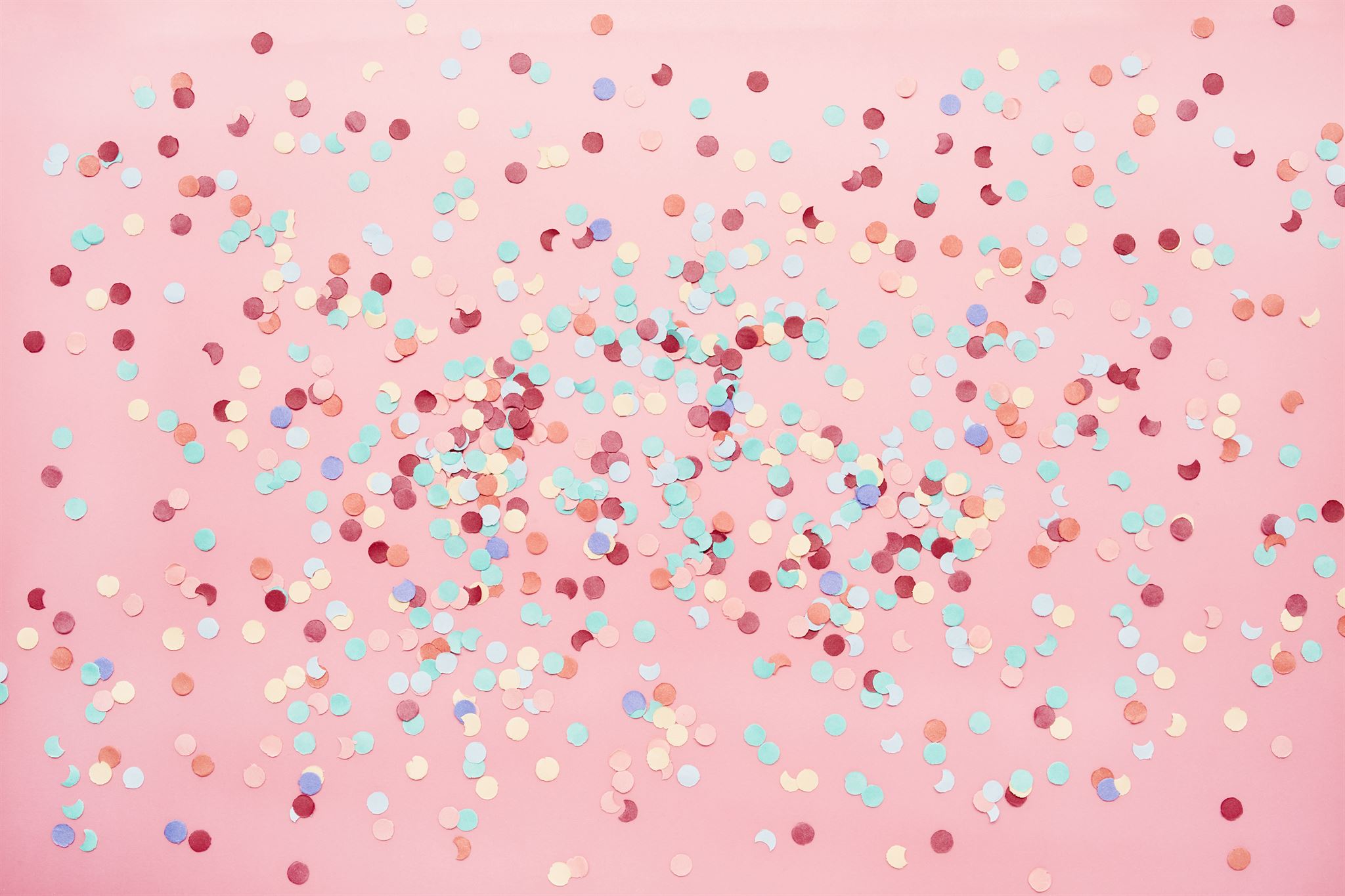 Colorful-confetti-on-pink-background
